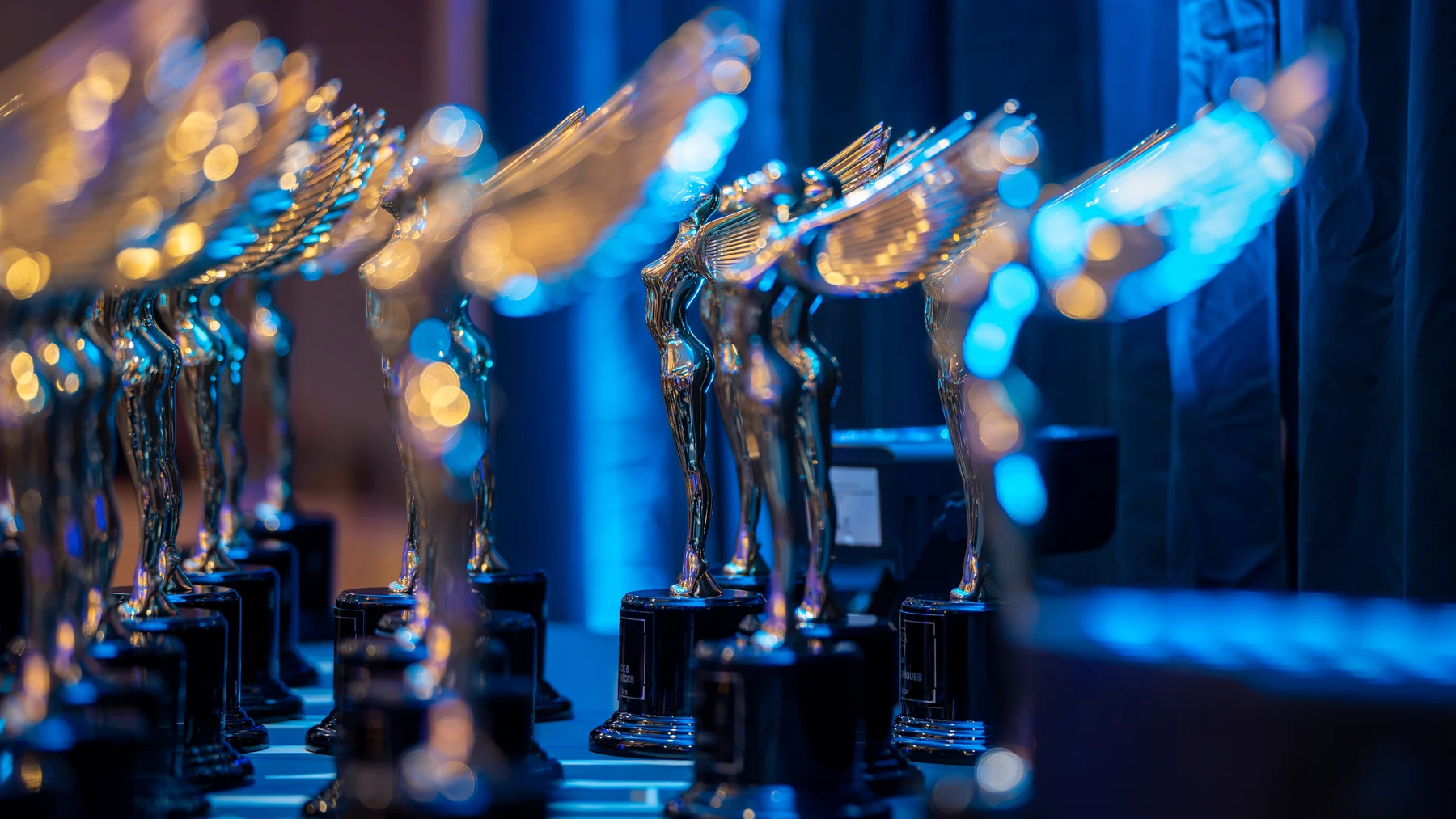 Row of America Awards trophies awaiting presentation