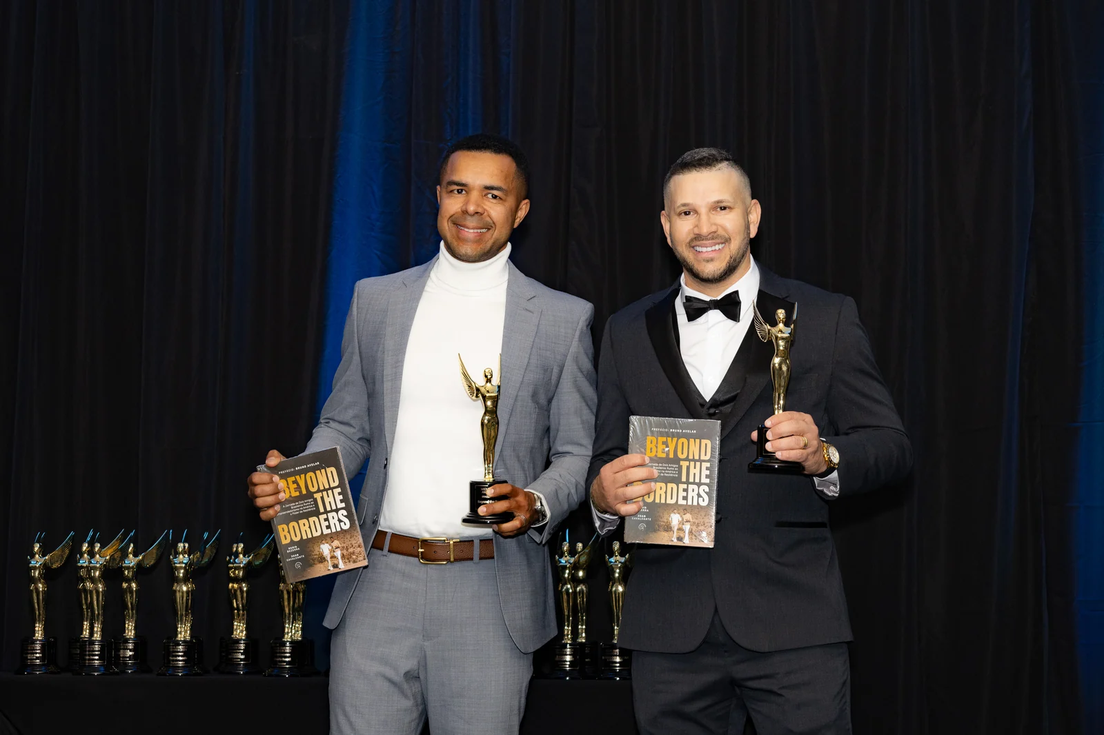 Honorees on stage with their awards at The America Awards ceremony